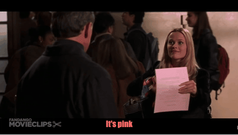 Animated GIF of a woman handing her professor a pink document